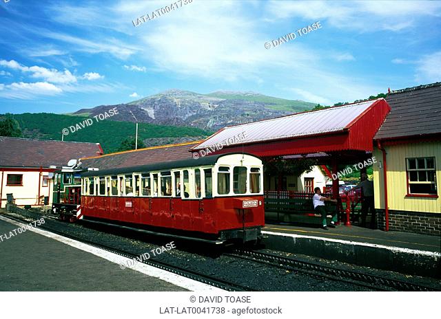 Snowdonia National Park. Snowdon Mountain Railway. Station platform. Train. Red and white paint. People