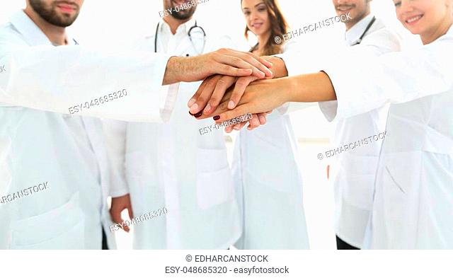 Doctors and nurses in a medical team stacking hands.concept of teamwork