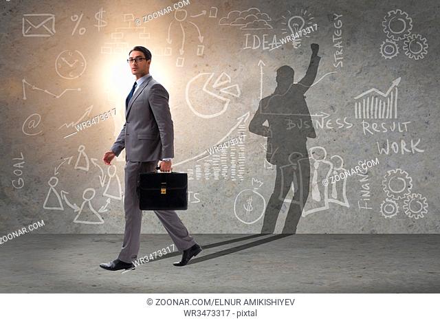Businessman and his shadow in business concept
