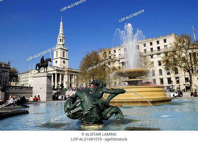 England, London, Trafalgar Square. Fountain in Trafalgar Square, with Church of St Martin-in-the-Fields in the background