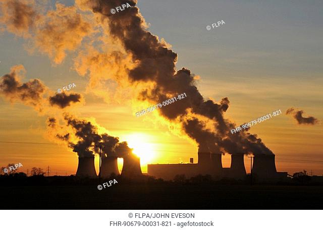 Coal-fired power station at sunset, cooling towers billowing out steam, Drax Power Station, Goole, North Humberside, Yorkshire, England