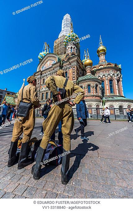 Soviet soldiers selling souvenirs in fron of the Church of the Savior on Blood, St Petersburg, Russia