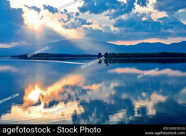 Beautiful Nature Background.Amazing Colorful Clouds.Water Reflections.Magic Artistic Wallpaper.Creative Photography.Blue Sky and Sunset