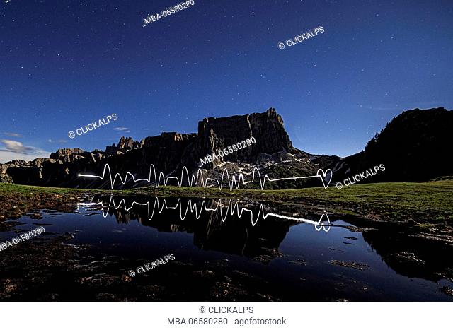 Light painting in front of Lastroni of Formin at Giau Pass during a full moon night, Cortina d'Ampezzo, Dolomites, Veneto, Italy, Europe