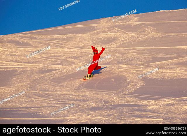 Snowboarder in funny shrimp kigurumi pajamas costume at ski slope