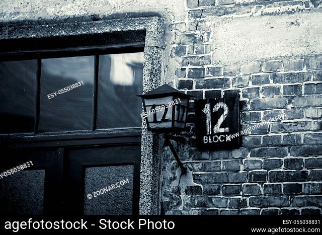 AUSCHWITZ POLAND March 12 2019 Name board and lantern with number 12 at shed block by Concentration Camp