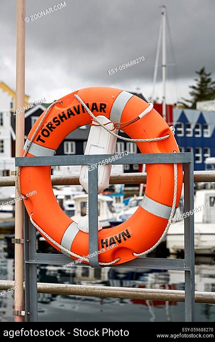 Lifering in port area with name of town of Torshavn, Faroe Islands, Denmark written on it