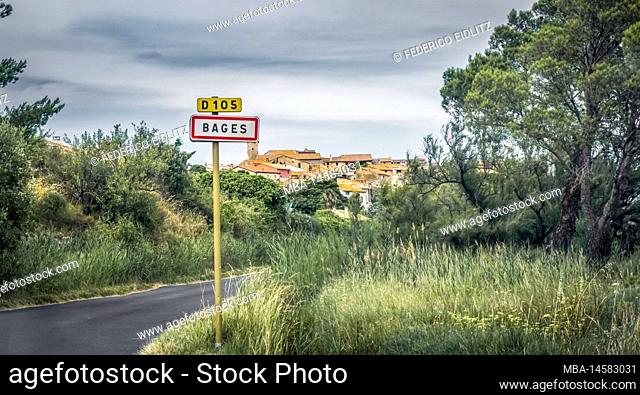 Place name sign of Bages. The commune is located in the Regional Natural Park Narbonnaise en Mediterranee
