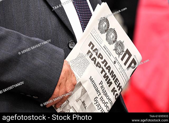 RUSSIA, MOSCOW - SEPTEMBER 3, 2023: A man holds a newspaper before a ceremony held by supporters of the Russian Communist Party (KPRF) to lay flowers at the...