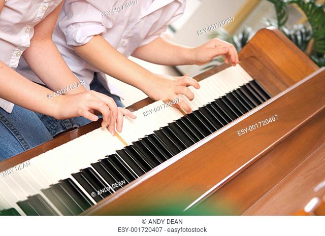 Children Playing the Piano