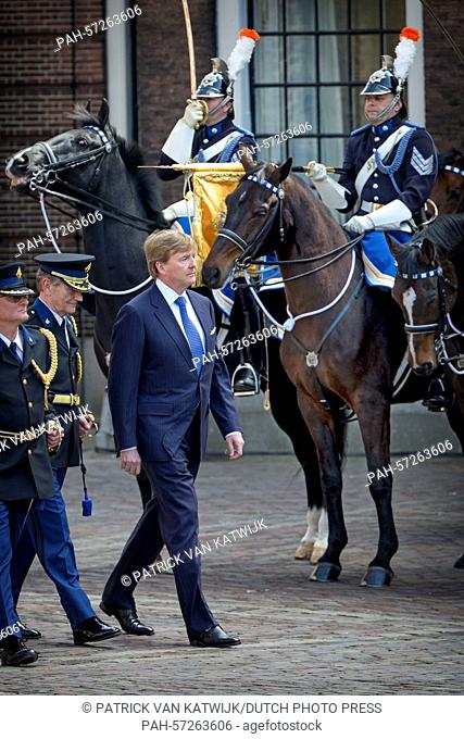 King Willem-Alexander of The Netherlands presents the new standaard (banner) to the Police chief of the National Palace at the square of the Binnenhof in The...