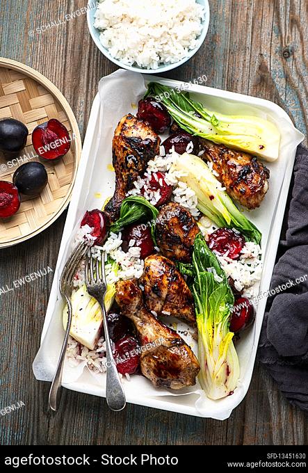 Chicken legs with plums and bok choy