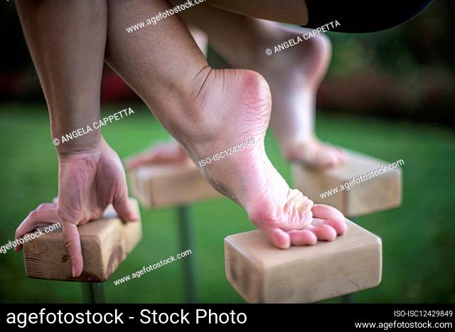 Gymnast balancing on blocks outdoors
