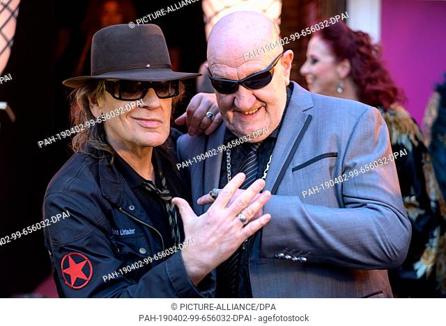 02 April 2019, Hamburg: Udo Lindenberg, singer and entertainer, and his former bodyguard Eddy Kante celebrate the opening of the burlesque nightclub ""The Bunny...