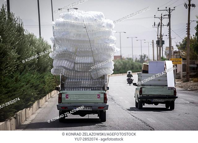 Pickup truck carrying plastic bottles on the road in Kashan, Isfahan Province in Iran
