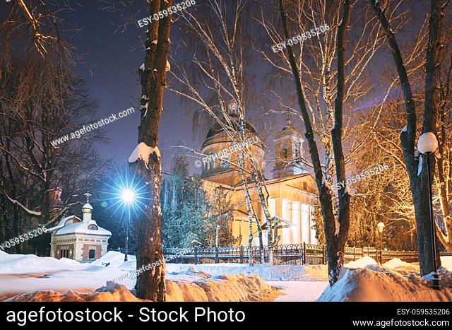 Gomel, Belarus. City Park In Winter Night. Peter And Paul Cathedral In Homiel Rumyantsevs And Paskeviches Park. Famous Local Landmark In Snow