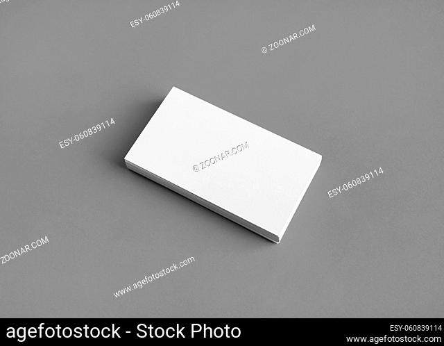 Photo of blank business card on gray paper background. Template for branding identity. Mockup for ID