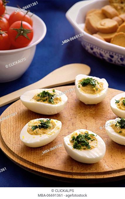 Fille eggs with tona and mayonnaise