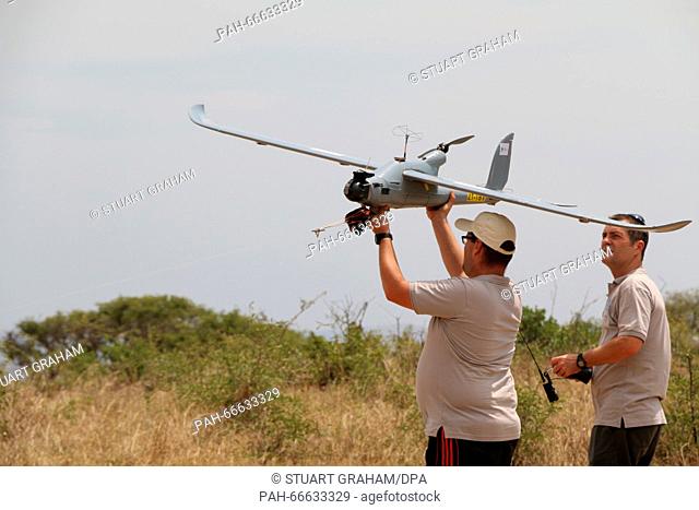 Two Air Shepherd pilots prepare a drone for take-off in the Hluhluwe-Imfolozi Park located in KwaZulu-Natal province, South Africa, 15 February 2016