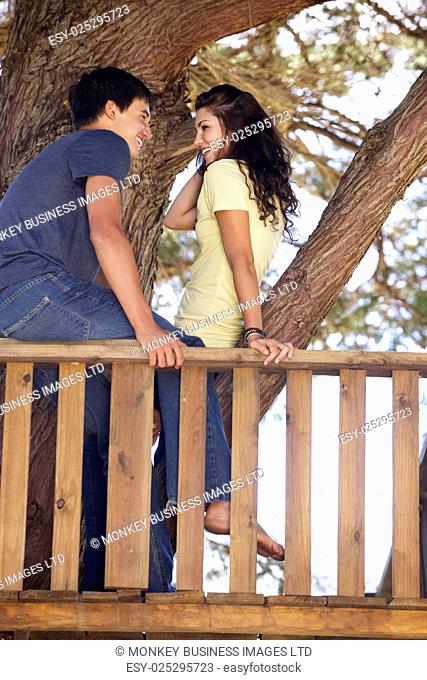 Teenage Couple In Treehouse