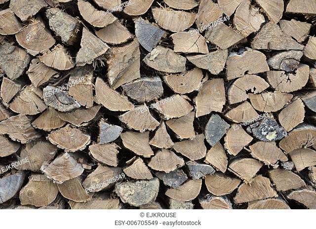 Split and stacked firewood winter readiness background