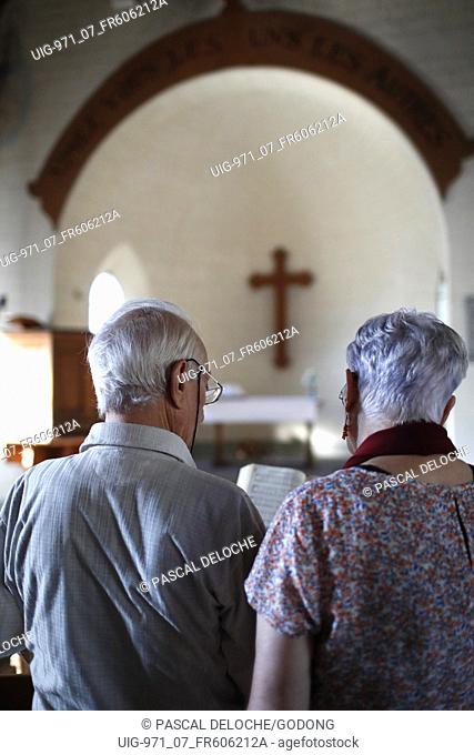 Protestant church. Sunday service. Couple praying. France