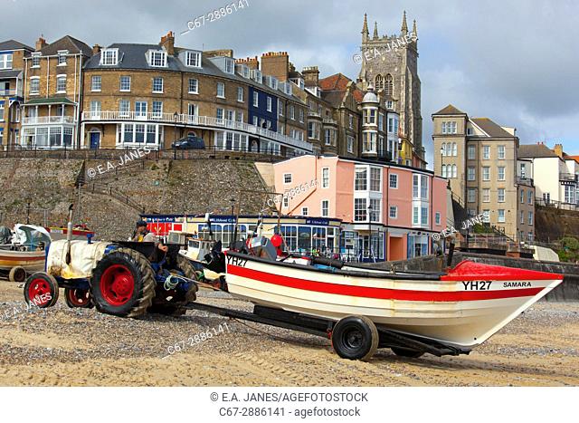 Crab boats on Cromer beach town and church in background Norfolk