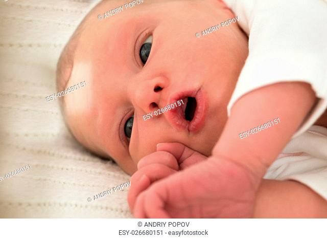 Close-up Of A Cute Little Baby Girl Lying