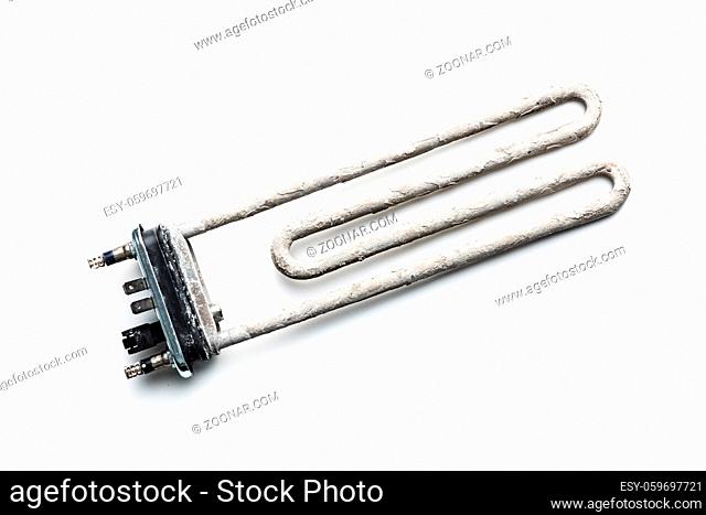 Old washing machine heater with limescale isolated on white background