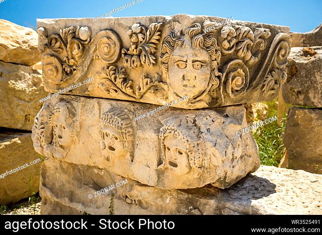 Carved Greek masks as decoration from the theatre of of Myra, Turkey