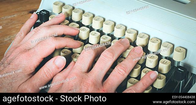 Vintage typewriter: Hands are typing a text