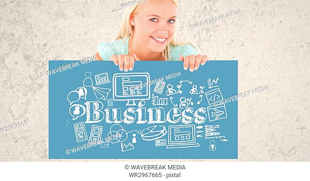 Portrait of beautiful woman holding billboard with business text and symbols while standing against