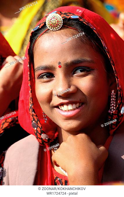 Portrait of smiling Indian girl at Pushkar camel fair