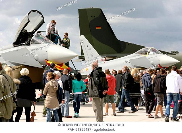 Visitors look at a Eurofighter during the open house at the tactical fighter group 73 ""Steinhoff"" abover the air field Rostock-Laage, Germany, 23 August 2014