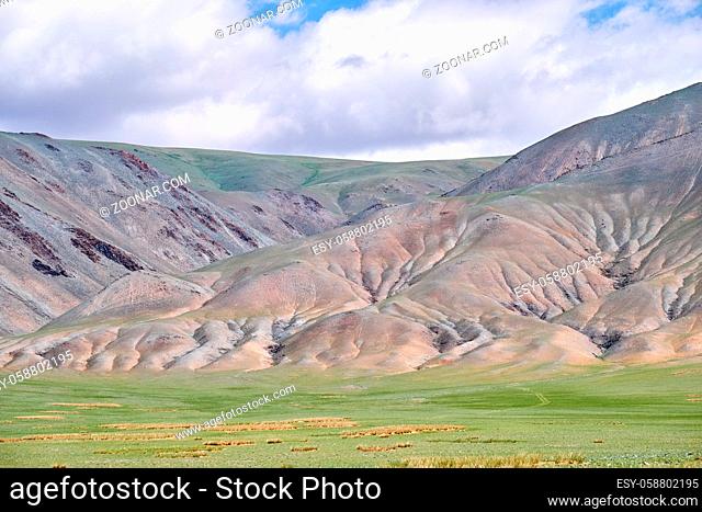 Mongolian mountain natural landscapes with eroded foothill slopes near lake Tolbo-Nuur in north Mongolia