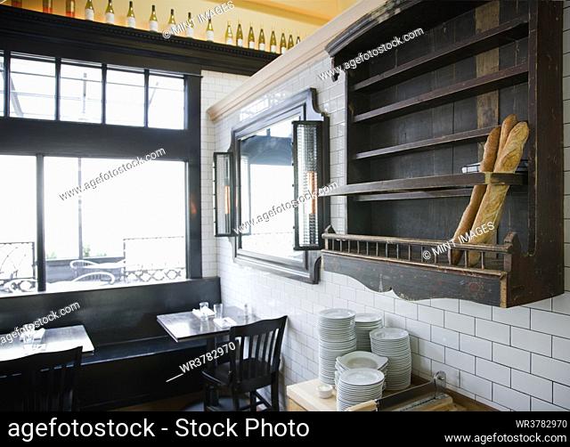 Baguettes in wooden wall rack at French Restaurant