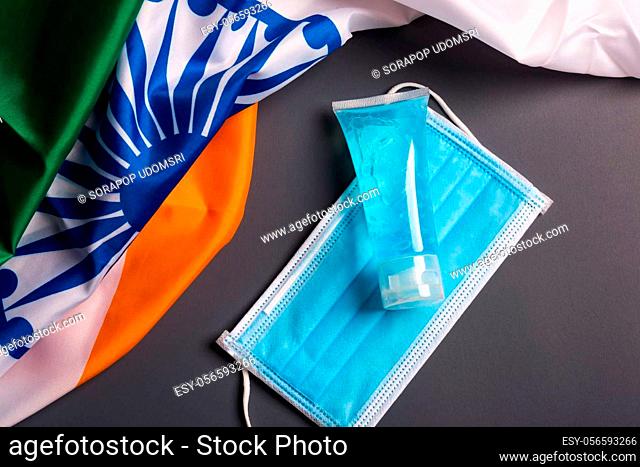 Medical protective disposable face mask for cover mouth with India flag, studio shot on gray background, Safety healthcare medical prevent coronavirus or...