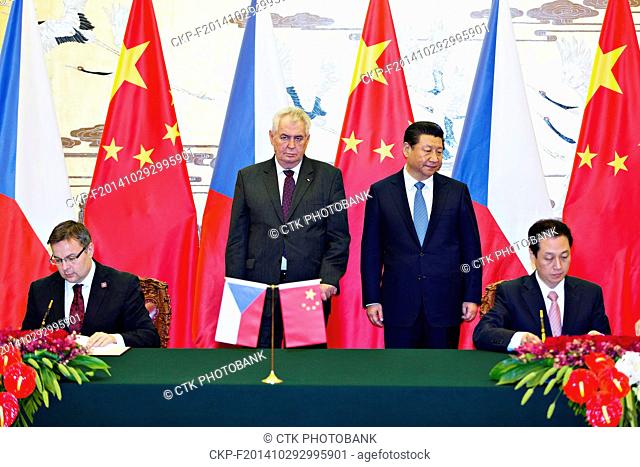 Czech Republic's President Milos Zeman, center left, talks with Chinese President Xi Jinping, center right, during a signing ceremony at the Great Hall of the...
