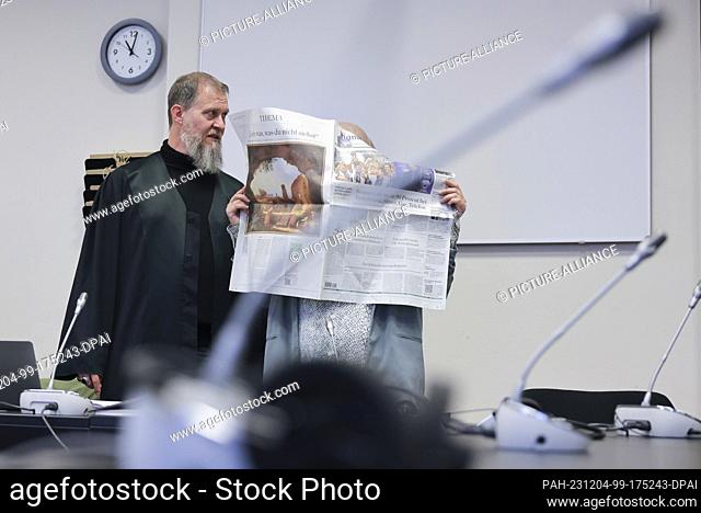 04 December 2023, Hamburg: The defendant (r) and her lawyer Martin Heising stand in the courtroom in the criminal justice building at the start of the trial