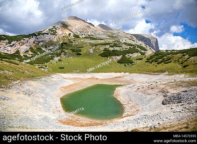 Italy, south tyrol, bolzano, fanes senes braies natural park. The Limo lake - Lago di Limo, semi-dried due to the extraordinarily hot climate of summer 2022