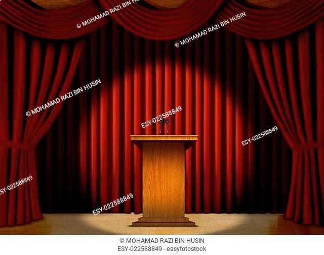 Podium in a spot light on stage over red curtains