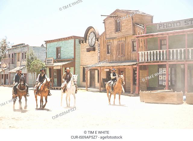 Gang of cowboys riding horses on wild west film set, Fort Bravo, Tabernas, Almeria, Spain