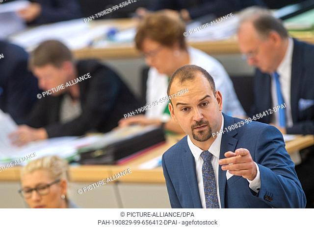 29 August 2019, Saxony-Anhalt, Magdeburg: Daniel Roi (AfD) speaks in the Landtag of Saxony-Anhalt. There, the deputies debated the dismissal of the politician...