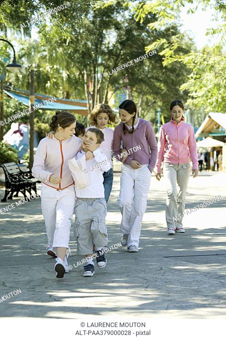 Group of children walking through amusement park