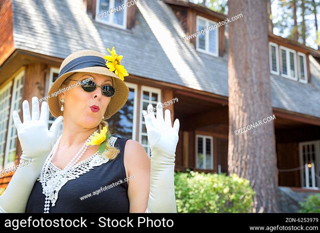 Attractive Young Woman in Twenties Outfit Near Antique House
