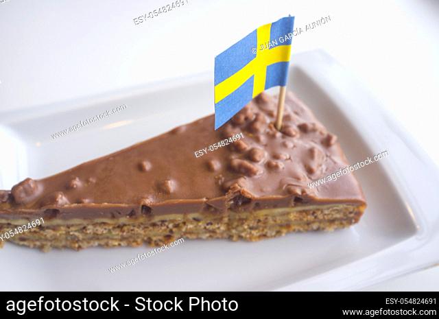Daim chocolate cake with the flag of Sweden. Closeup