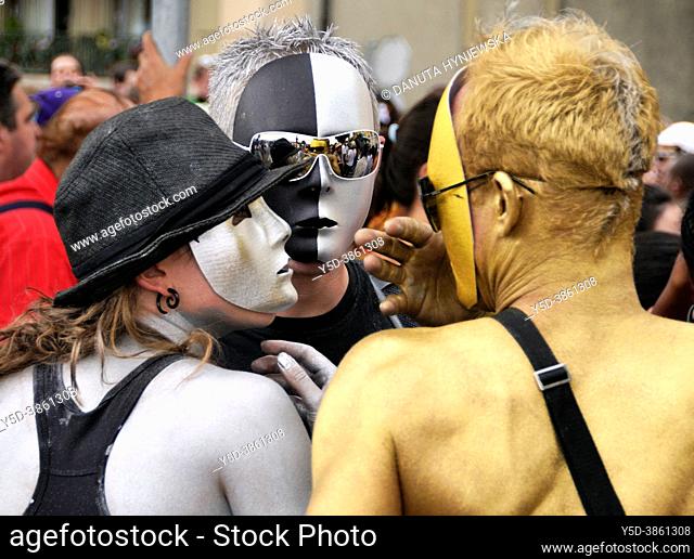 Portrait of three young people wearing masks, silver and gold painted bodies, Lake Parade - LGBT Parade, Pride Parade, Geneva, Quai du Mont Blanc
