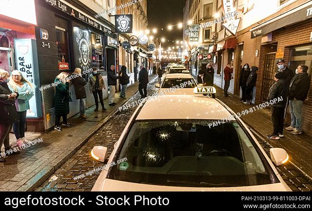 13 March 2021, Hamburg: Taxi drivers support the neighborhood restaurateurs affected by the lockdown with a car parade through Hamburg's red light district...