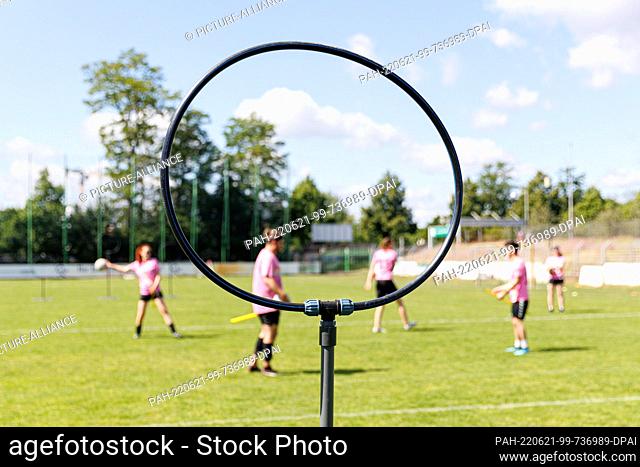 11 June 2022, Lower Saxony, Hanover: A stand with a ring that serves as a goal stands on the field. Quidditch is a contact sport played in mixed-gender teams...
