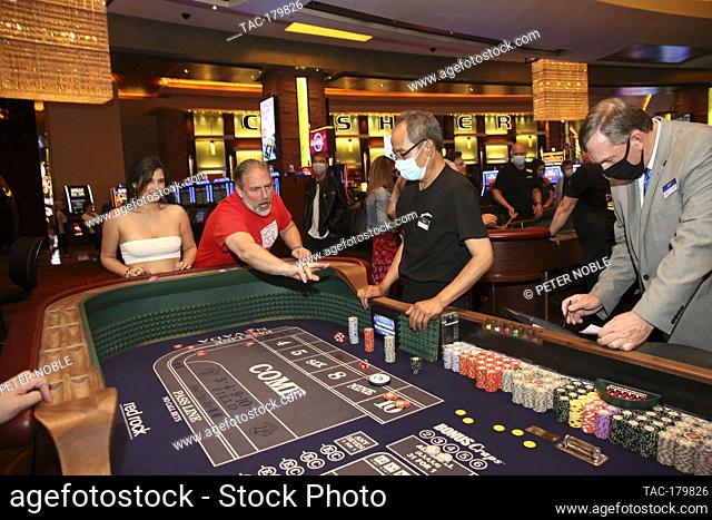 Las Vegas, NV - June 4, 2020: People play Craps during the Grand Re-Opening of Red Rock Casino Resort & Spa at 12:01 AM on June 4, 2020 in Las Vegas, Nevada